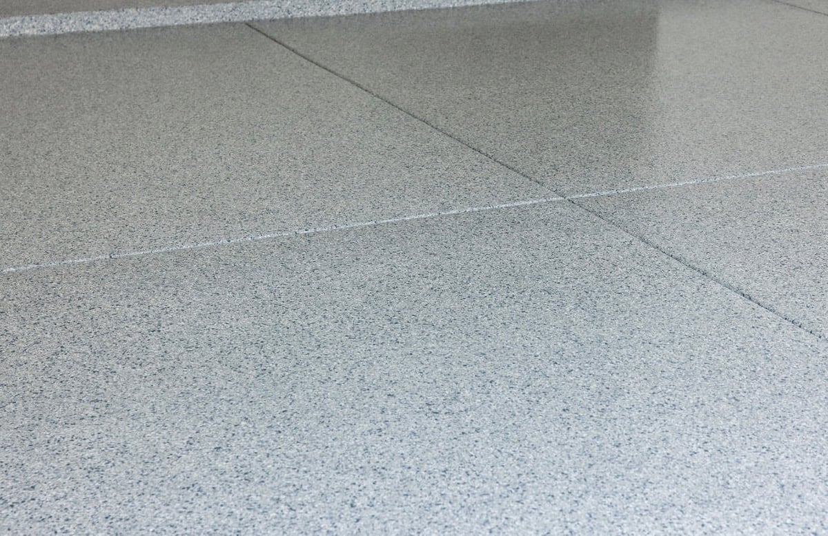 Close-up of polished concrete floor with control joints dividing the surface